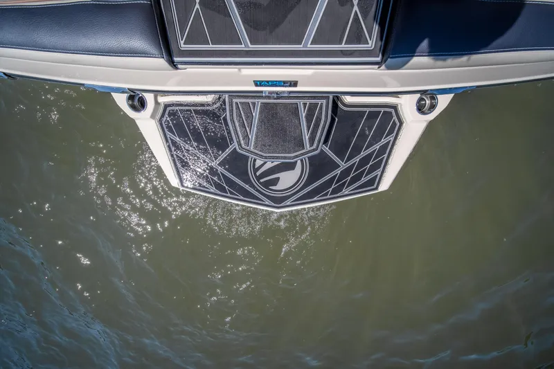Slide: The Image of 2025 Tigé Ultré 23ZX boat platform above water, showcasing sleek design and craftsmanship. - 37