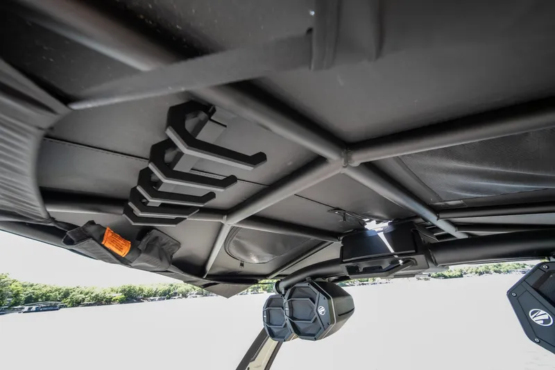 Slide: The Image of 2025 Tigé Ultré 23ZX boat interior roof with speakers and storage hooks. - 39