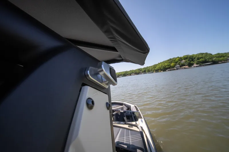 Slide: The Image of 2025 Tigé Ultré 23ZX boat on a sunny lake, showcasing sleek design and modern features. - 40