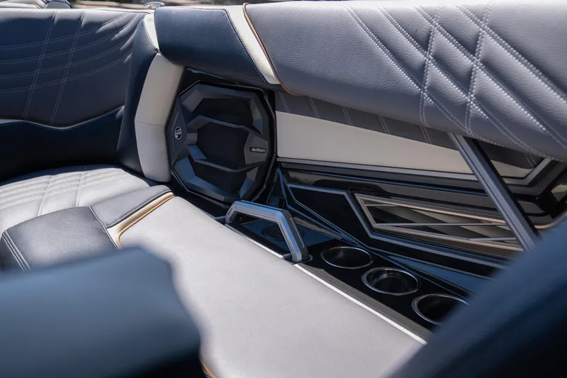 Slide: The Image of 2025 Tigé Ultré 23ZX interior with premium seating and integrated speaker system. - 47