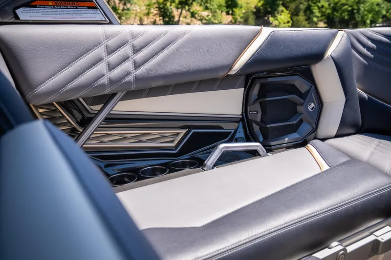 Slide: The Image of 2025 Tigé Ultré 23ZX interior with sleek seating and integrated speaker system. - 49