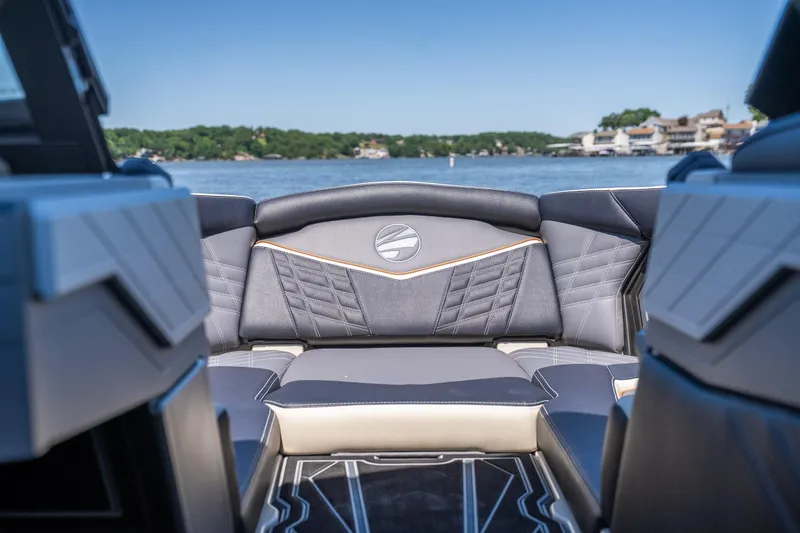 Slide: The Image of 2025 Tigé Ultré 23ZX boat interior with luxurious seating and lake view. - 8