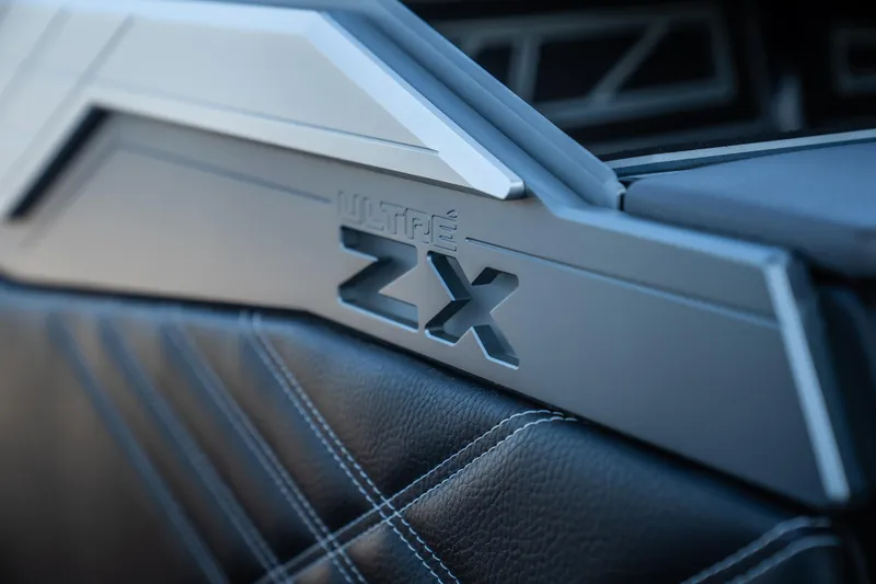 Slide: The Image of 2025 Tigé Ultré 23ZX interior detail with sleek design and stitching. - 9