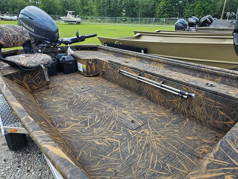Slide: The Image of 2025 G3 Gator Tough 15 DK boat with camouflage interior and Yamaha motor. - 10