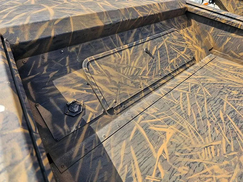 Slide: The Image of 2025 G3 Gator Tough 15 DK boat interior with camouflage pattern and storage compartment. - 16