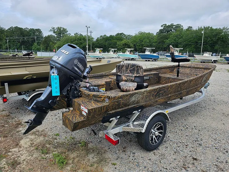 Slide: The Image of 2025 G3 Gator Tough 15 DK boat with Yamaha motor on a trailer. - 2
