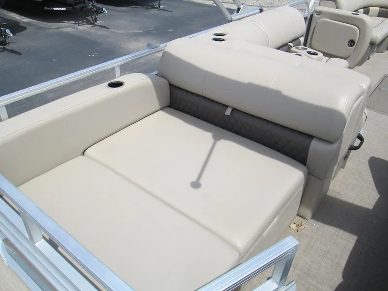 Slide: The Image of 2023 Sun Tracker PARTY BARGE 22RF XP3 pontoon boat with beige seating and cup holders. - 12