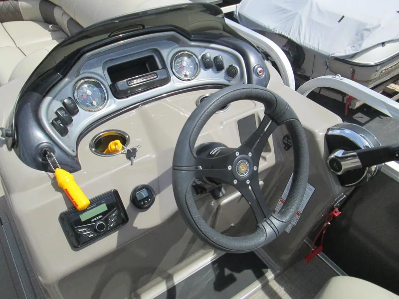 Slide: The Image of 2023 Sun Tracker PARTY BARGE 22RF XP3 dashboard with steering wheel and controls. - 14