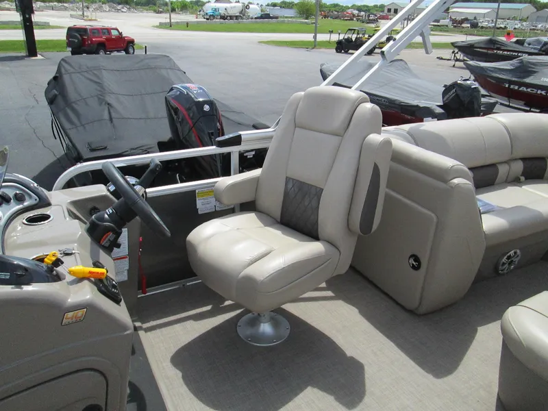 Slide: The Image of 2023 Sun Tracker PARTY BARGE 22RF XP3 pontoon boat with beige captain's chair and steering console. - 15