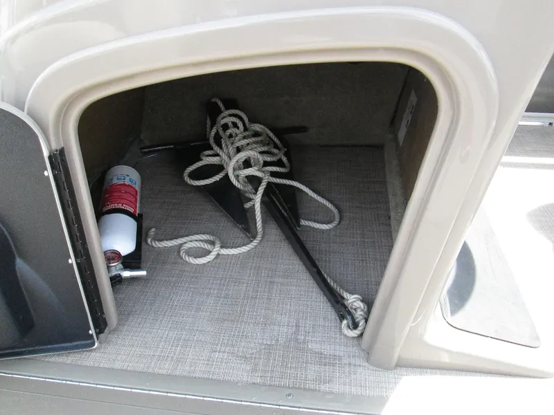 Slide: The Image of Storage compartment in 2023 Sun Tracker PARTY BARGE 22RF XP3 with anchor and fire extinguisher. - 17