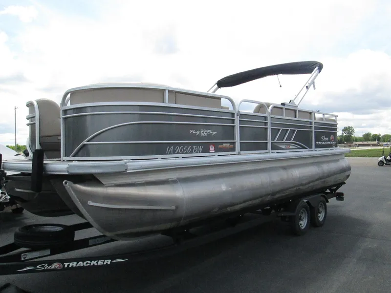 Slide: The Image of 2023 Sun Tracker PARTY BARGE 22RF XP3 pontoon boat on trailer, side view. - 3