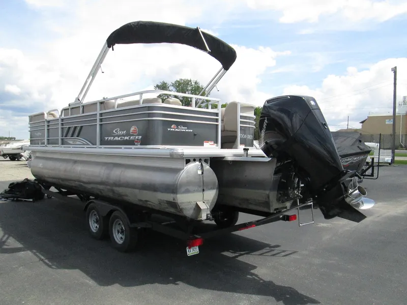 Slide: The Image of 2023 Sun Tracker PARTY BARGE 22RF XP3 pontoon boat on trailer, rear view. - 5