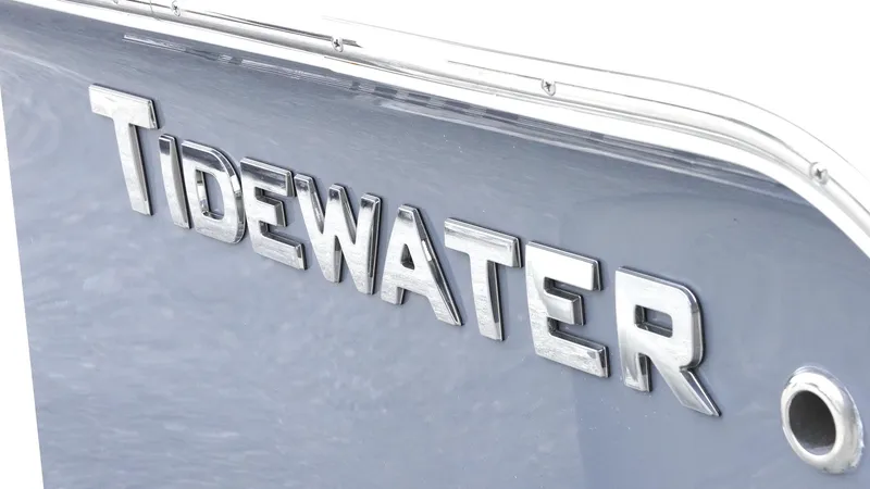 Slide: The Image of 2025 Tidewater 198 CC Adventure boat logo in sleek silver lettering. - 10