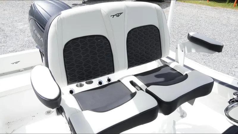 Slide: The Image of 2025 Tidewater 198 CC Adventure boat seats with black and white upholstery. - 16