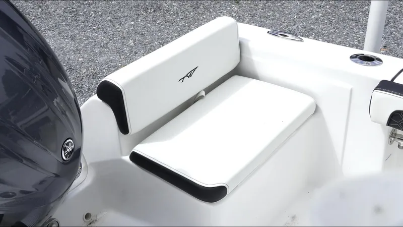 Slide: The Image of 2025 Tidewater 198 CC Adventure boat seat with sleek white upholstery and black accents. - 21