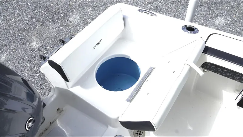 Slide: The Image of 2025 Tidewater 198 CC Adventure boat interior with seating and storage compartment. - 29
