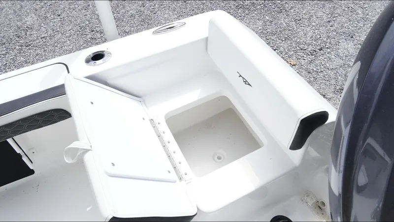 Slide: The Image of 2025 Tidewater 198 CC Adventure boat interior with open storage compartment. - 30