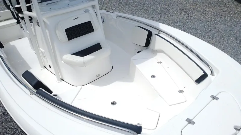 Slide: The Image of 2025 Tidewater 198 CC Adventure boat interior with seating and storage compartments. - 5