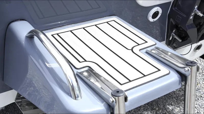 Slide: The Image of 2025 Tidewater 198 CC Adventure boat swim platform with stainless steel rails. - 8