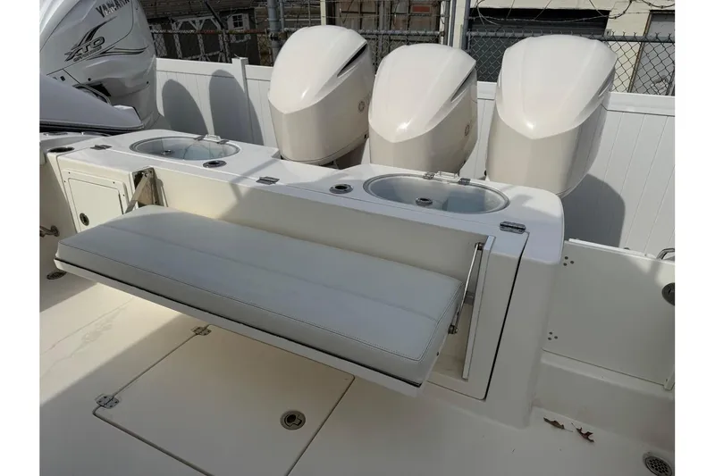 Slide: The Image of 2017 Cobia 344 Center Console boat with Yamaha engines and foldable seating. - 10