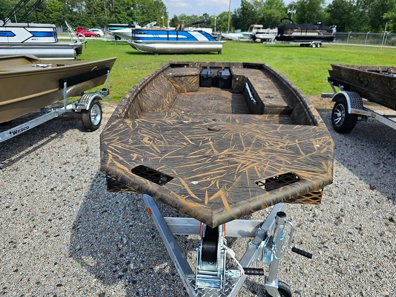 Slide: The Image of 2025 G3 Gator Tough 15 DK boat with camouflage design on a trailer. - 11
