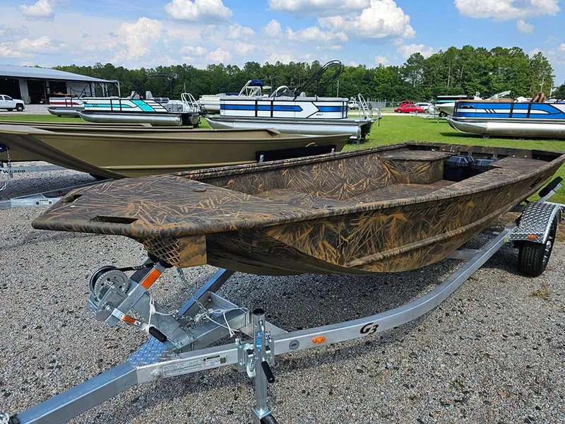Slide: The Image of 2025 G3 Gator Tough 15 DK boat on trailer, camo design, outdoor display. - 12