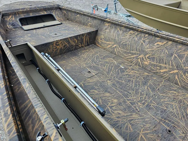 Slide: The Image of 2025 G3 Gator Tough 15 DK boat interior with camouflage design and storage compartments. - 17