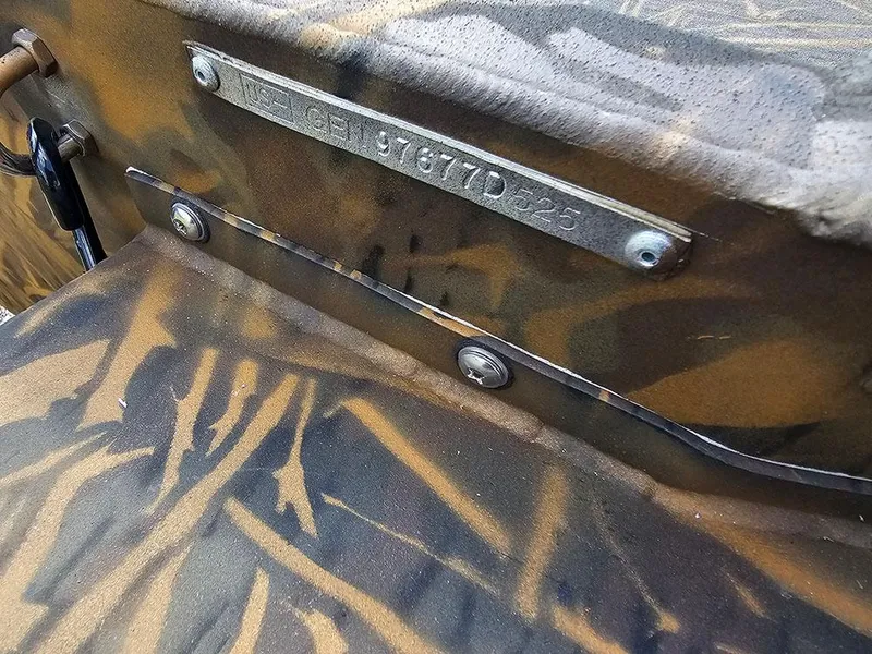 Slide: The Image of Camouflage-patterned G3 Gator Tough 15 DK boat, 2025 model, with visible serial number plate. - 19