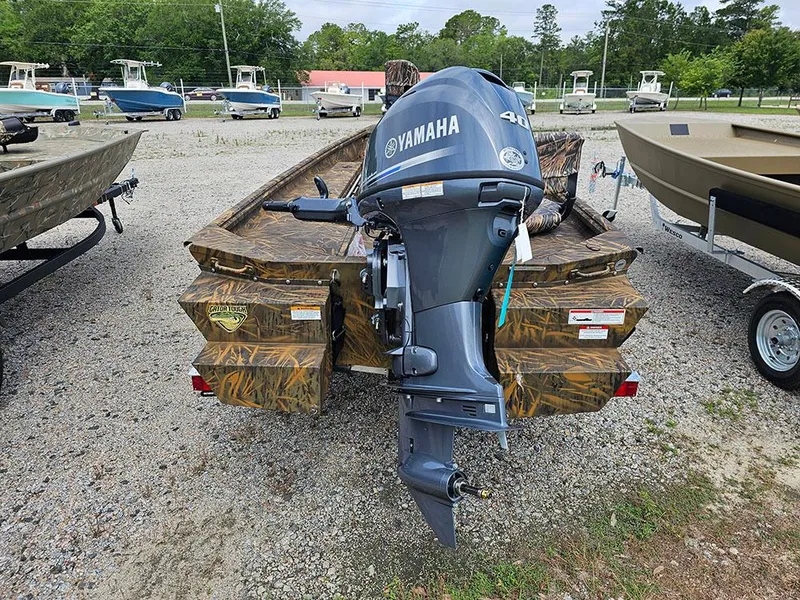 Slide: The Image of 2025 G3 Gator Tough 15 DK boat with Yamaha outboard motor, parked on gravel. - 6