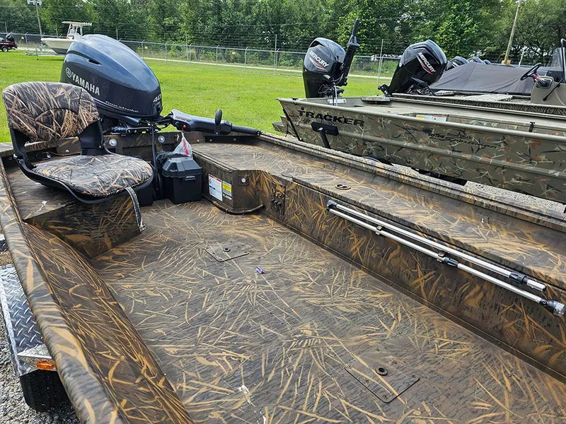 Slide: The Image of 2025 G3 Gator Tough 15 DK boat with camo design and Yamaha motor. - 8