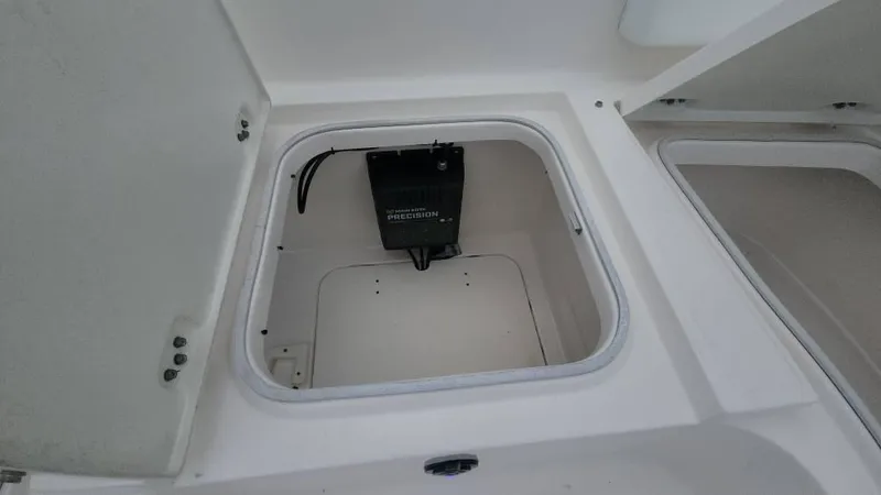 Slide: The Image of Open storage compartment on 2020 Robalo 246 Cayman boat. - 26