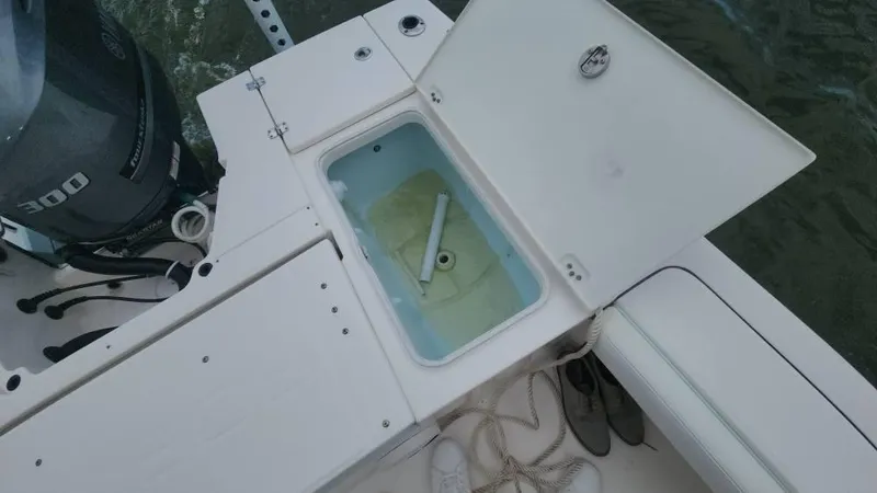 Slide: The Image of 2020 Robalo 246 Cayman boat with open storage compartment and Yamaha 300 engine. - 40