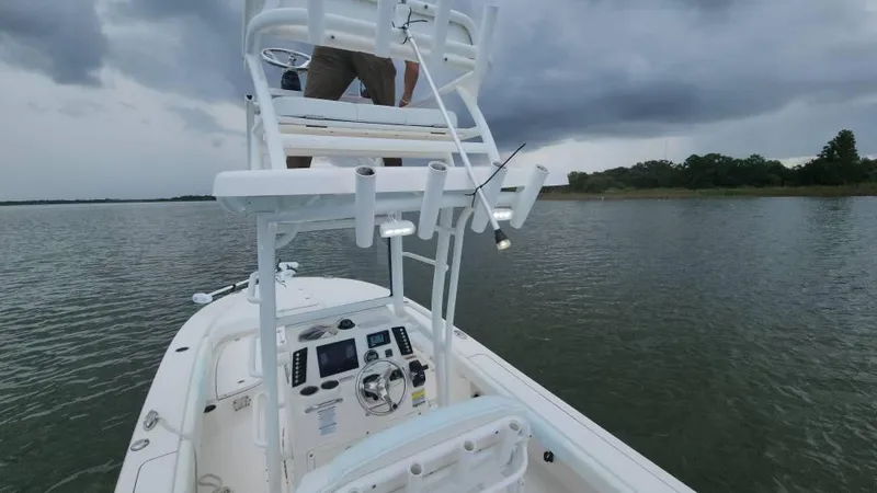 Slide: The Image of 2020 Robalo 246 Cayman boat on water under cloudy sky. - 42