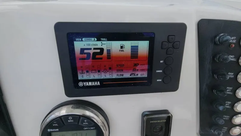 Slide: The Image of Yamaha display on 2020 Robalo 246 Cayman boat dashboard showing engine data. - 46