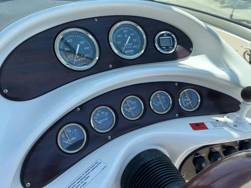Slide: The Image of Dashboard of 2000 Chris-Craft 260DB boat with gauges and controls. - 12