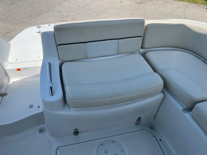 Slide: The Image of Chris-Craft 260DB 2000 boat seating area with white cushioned seats. - 17