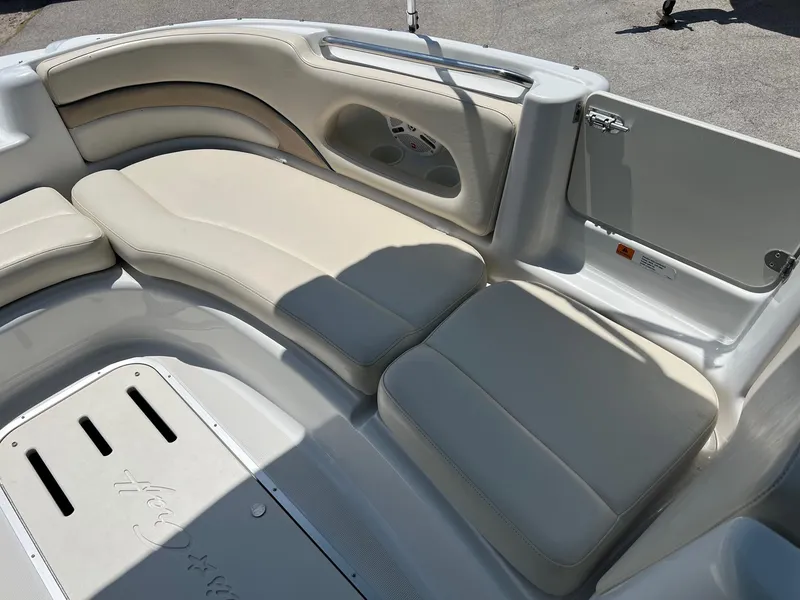 Slide: The Image of 2000 Chris-Craft 260DB boat interior with beige seating and sleek design. - 22