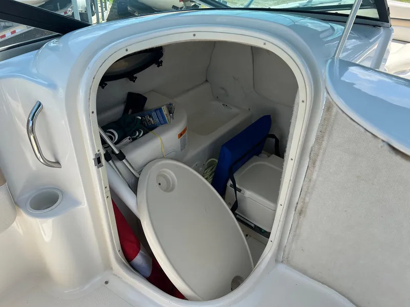 Slide: The Image of 2000 Chris-Craft 260DB boat cabin interior with storage and seating. - 27