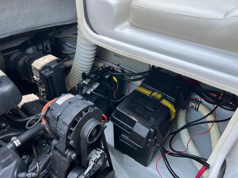 Slide: The Image of Engine compartment of a 2000 Chris-Craft 260DB boat, showing batteries and wiring. - 31