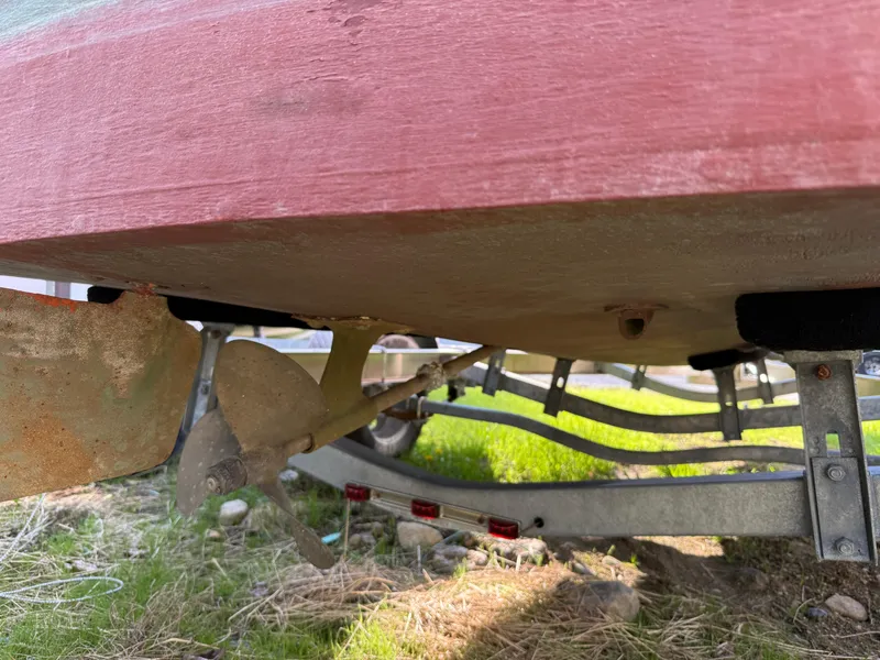 Slide: The Image of Underneath view of a 1932 Chris-Craft 301 boat showing propeller and trailer. - 14