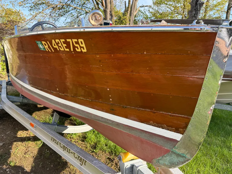 Slide: The Image of 1932 Chris-Craft 301 wooden boat on trailer, showcasing vintage craftsmanship and design. - 3