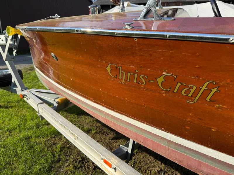 Slide: The Image of 1932 Chris-Craft 301 wooden boat on trailer, showcasing classic design and craftsmanship. - 5