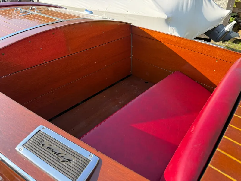 Slide: The Image of Vintage 1932 Chris-Craft 301 boat interior with red seating and wooden finish. - 8