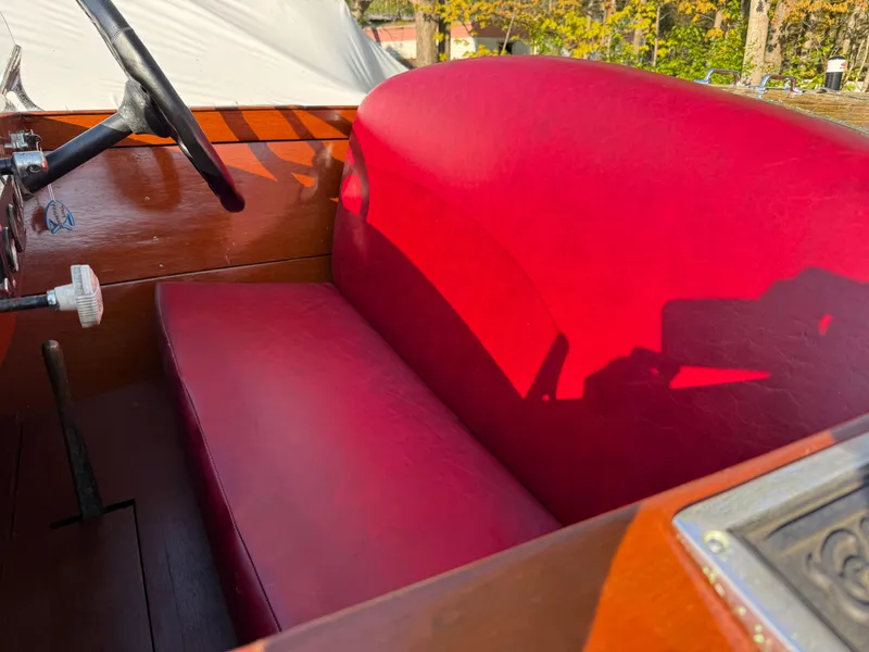 Slide: The Image of Red leather interior of a 1932 Chris-Craft 301 boat with wooden accents. - 9