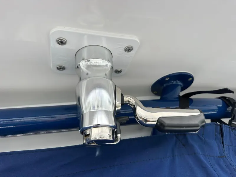 Slide: The Image of Chrome boat fitting on 2013 SeaHunter 35 Tournament, featuring a sturdy handle and blue fabric. - 13