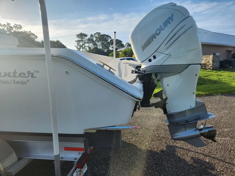 Slide: The Image of 2013 SeaHunter 35 Tournament boat with Mercury outboard engine on a trailer. - 19