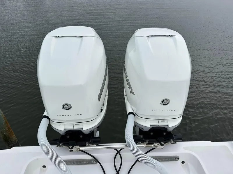 Slide: The Image of Twin Mercury outboard engines on a 2013 SeaHunter 35 Tournament boat. - 29