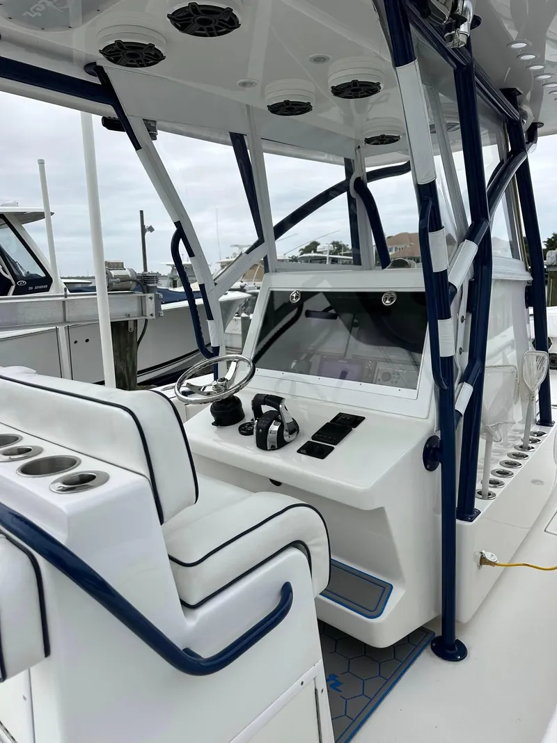Slide: The Image of 2013 SeaHunter 35 Tournament boat interior with modern helm and seating. - 35