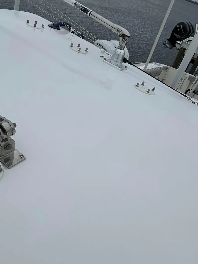 Slide: The Image of 2013 SeaHunter 35 Tournament boat deck with hardware, near water. - 8