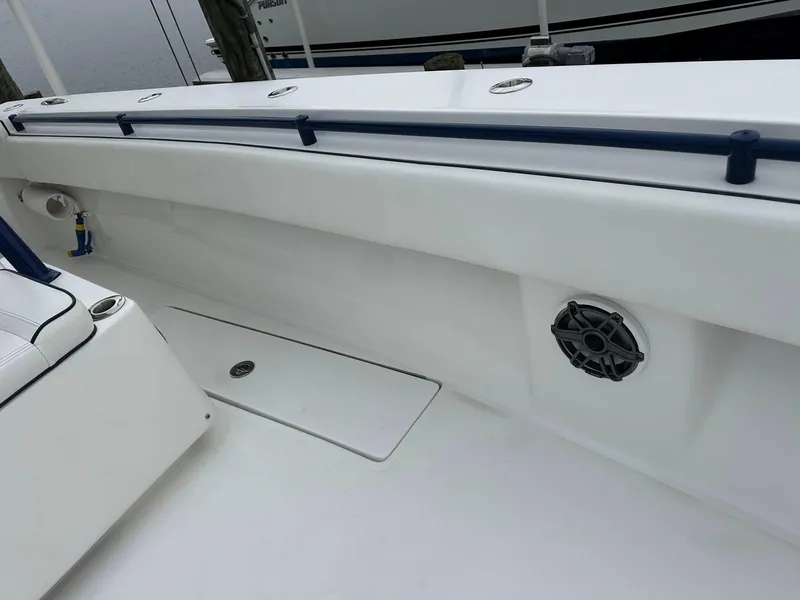 Slide: The Image of 2013 SeaHunter 35 Tournament boat interior with speaker and storage compartment. - 9